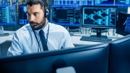 In the System Monitoring Room Dispatcher Wearing Headset Observers Proper Functioning of the...