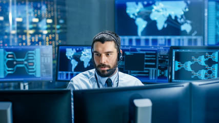 In the System Monitoring Room Dispatcher Wearing Headset Observers Proper Functioning of the...