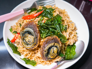 noodle with brasil leaf and fried century egg