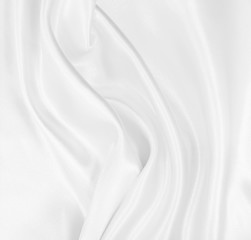 Smooth elegant white silk or satin luxury cloth texture as wedding background. Luxurious background design