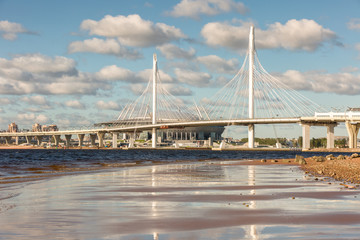 Obraz premium New highway road with cable-stayed bridge over the Neva river in St.Petersburg