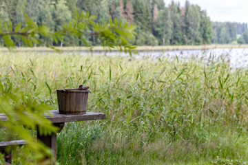 An old wooden bucket near the lake, Finland
