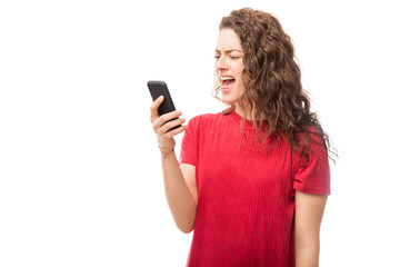 Angry woman yelling at her cell phone