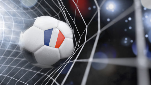 Realistic soccer ball in the net with the flag of French Guiana.(series)