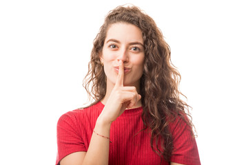 Cute woman gesturing silence