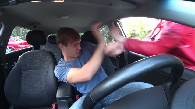the rudeness of a stressed and angry car driver gesturing. the man yells from the window of his car. 4k