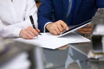 Bookkeepers team or financial inspectors  making report, calculating and checking balance. Tax service financial document. Audit or meeting concept