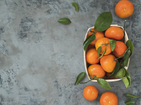 Fresh tangerines with leaves © PINKASEVICH