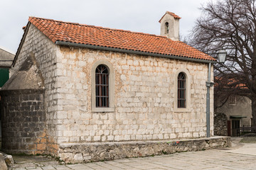 Fototapeta premium Small church in the center of Beli on a cloudy day in spring