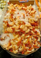 Raw, jumbo shrimp on ice for sale at a seafood market