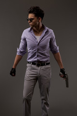 shooter with handgun looking determined