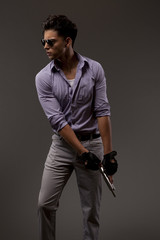 Fototapeta premium stylish shooter with handgun