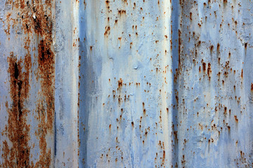 Old metal blue painted background with streaks of rust for creativity, textures and backgrounds.