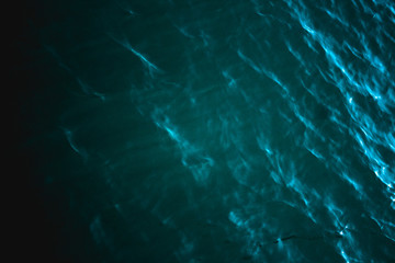 Black sea texture. Turquoise dark sea water with ripple. Peaceful nature minimal concept.