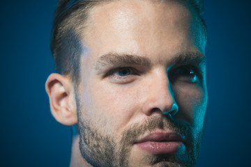 Man portrait. Closeup attractive unshaven man. Cropped portrait charming man with light smile. Fashion male model. Confident, successful, satisfied businessman. People, lifestyle and emotion concept.