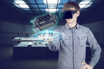 Virtual reality in mechanical engineering. 3d engineer in shirt looking through vr glasses at engine for heavy industry on futuristic plant background with control panels.