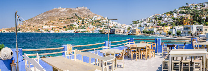 Beautiful white blue windmills of mediterranean greek villages called Agia Marina and Panteli with...