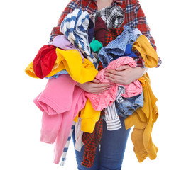 Woman holding dirty clothes on white background