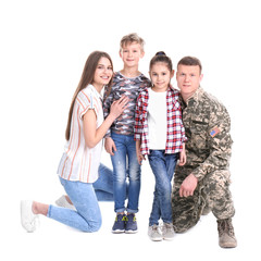 Obraz premium Male soldier with his family on white background. Military service