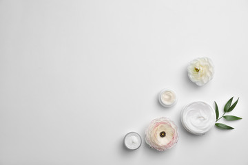 Flat lay composition with cosmetic products on light background