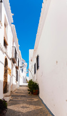 Fototapeta na wymiar beautiful, picturesque street, narrow road, white facades of buildings, Spanish architecture
