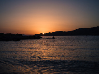 The sun sets over the sea in the wonderful Sardinia.