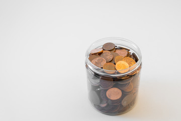 Isolated bunch of cent euro coins in transparent  bottle on white background