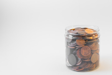 Isolated bunch of cent euro coins in transparent  bottle on white background