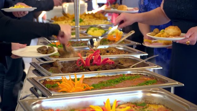 people group catering buffet food indoor in luxury restaurant with meat colorful fruits and vegetables.