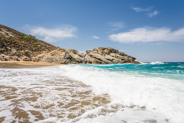Beautiful sunny cozy holiday bay with big waves with crystal clear blue water sandy beach and a small laguna for sunbathing swimming or surfing, Ikaria Island, Nas Beach, Samos, Sporades, Greece