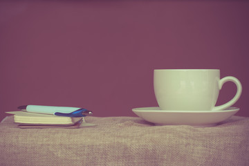 Coffee espresso on wood table nature background in garden,warm tone