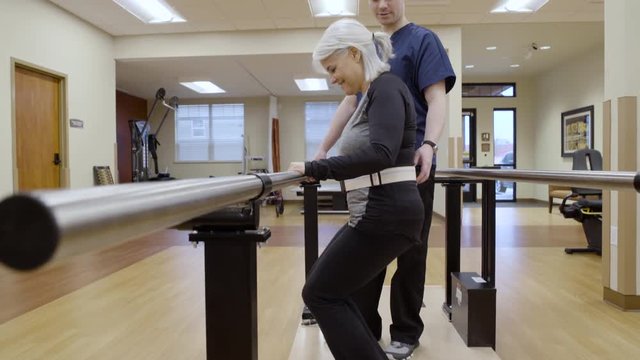 Medium shot of a senior woman doing squats