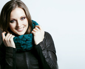 young pretty brunette woman in sweater and scarf all over her fa