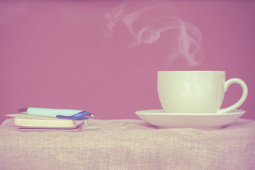 Coffee espresso on wood table nature background in garden,warm tone