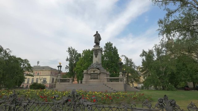 Statue of Adam Mickiewicz in a park