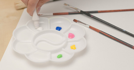 Putting Water color into palette for painting