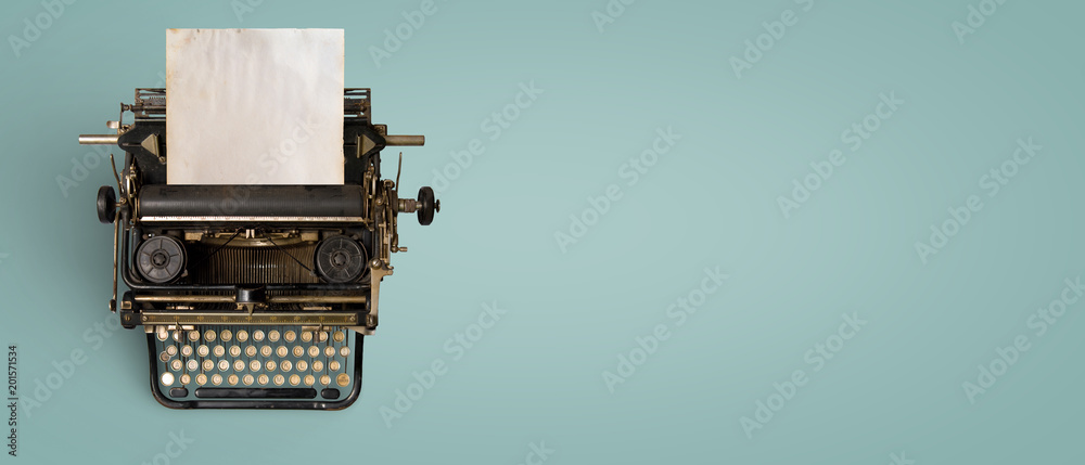 Fototapete vintage typewriter header with old paper. retro machine technology - top view and creative flat lay 