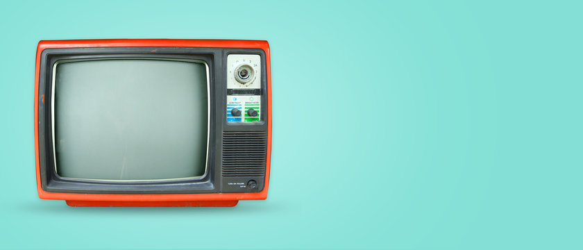 Retro television - old vintage tv on color background. retro technology. flat lay, top view hero header. vintage color styles.