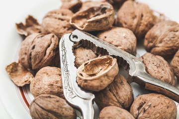 group of large walnuts and pincers