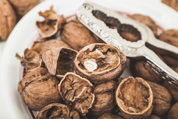 group of large walnuts and pincers