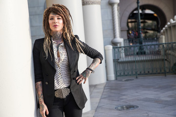 Smart, successful business woman with tattoos and dreadlocks