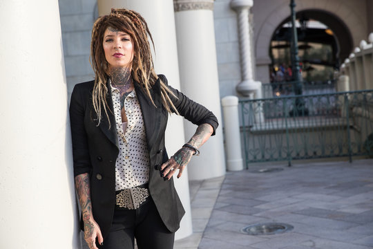 Smart, successful business woman with tattoos and dreadlocks Stock Photo |  Adobe Stock