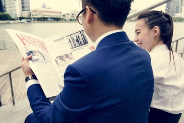 Asian business people in a city working together