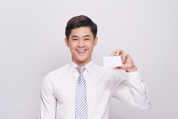 Young Man Holding Blank Visiting Card On white Background