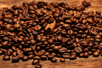 Freshly roasted coffee beans on an old wooden background