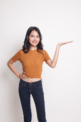 Young Asian woman present with her hand.