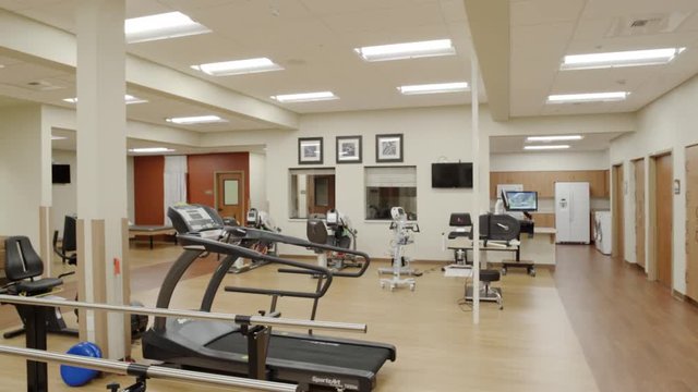 Wide shot of a rehabilitation gym at daytime