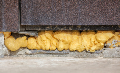 Construction foam in the wall slit as a background