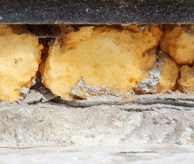 Construction foam in the wall slit as a background