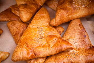 Close-up of fresh delicious samsa with meat and onions